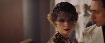Movie still from “Murder on the Orient Express” (2017), directed by Kenneth Branagh – A person wearing a veil; Close Up shot, Over the shoulder angle