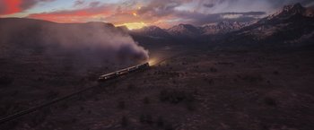 Movie still from “Murder on the Orient Express” (2017), directed by Kenneth Branagh – An aerial view of a train traveling through the desert; Extreme Wide shot, High angle