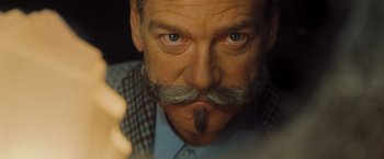 Movie still from “Murder on the Orient Express” (2017), directed by Kenneth Branagh – A person with a mustache; Close Up shot, Low angle