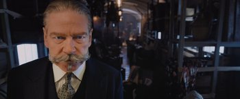 Movie still from “Murder on the Orient Express” (2017), directed by Kenneth Branagh – An older man with a beard and a mustache; Close Up shot, Low angle