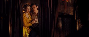 Movie still from “Murder on the Orient Express” (2017), directed by Kenneth Branagh – A man and a woman standing next to each other; Medium shot, Low angle