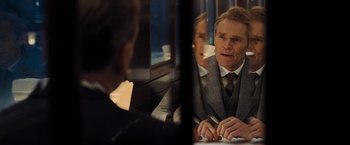 Movie still from “Murder on the Orient Express” (2017), directed by Kenneth Branagh – A man and a woman sitting in front of a train window; Close Up shot, Over the shoulder angle