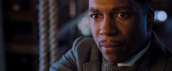 Movie still from “Murder on the Orient Express” (2017), directed by Kenneth Branagh – A man's face in a sweater; Close Up shot, High angle