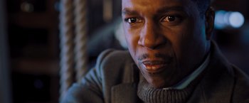 Movie still from “Murder on the Orient Express” (2017), directed by Kenneth Branagh – A man's face in a sweater; Close Up shot, High angle