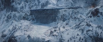 Movie still from “Murder on the Orient Express” (2017), directed by Kenneth Branagh – A train traveling over a bridge in the snow; Extreme Wide shot, High angle