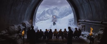 Movie still from “Murder on the Orient Express” (2017), directed by Kenneth Branagh – A group of people sitting in front of a train on the tracks; Extreme Wide shot, High angle
