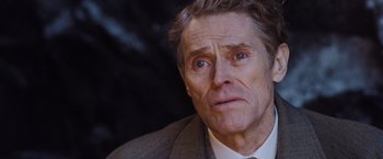 Movie still from “Murder on the Orient Express” (2017), directed by Kenneth Branagh – An older man wearing a suit and tie; Close Up shot, Low angle