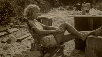 Movie still from “My Name Is Pauli Murray” (2021), directed by Betsy West – An old photo of a woman sitting in a chair; Medium shot, High angle