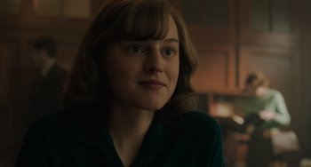 Movie still from “My Policeman” (2022), directed by Michael Grandage – A person wearing a suit jacket; Close Up shot, Over the shoulder angle