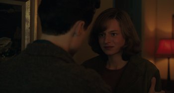 Movie still from “My Policeman” (2022), directed by Michael Grandage – A man and a woman looking at each other in a mirror; Close Up shot, Over the shoulder angle