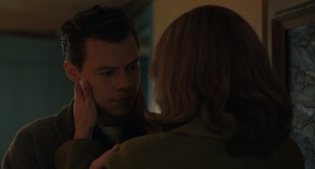 Movie still from “My Policeman” (2022), directed by Michael Grandage – A man and a woman looking in the same direction; Close Up shot, Over the shoulder angle