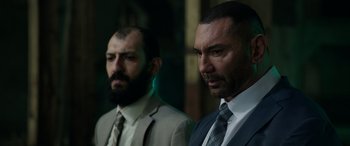 Movie still from “My Spy” (2020), directed by Peter Segal – Two men in suits and ties standing next to each other; Close Up shot, Low angle