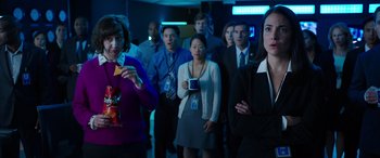 Movie still from “My Spy” (2020), directed by Peter Segal – A group of people standing in a dark room; Medium shot, Over the shoulder angle