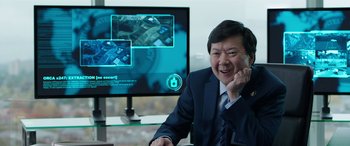 Movie still from “My Spy” (2020), directed by Peter Segal – A man sitting in front of a computer screen; Close Up shot, Over the shoulder angle