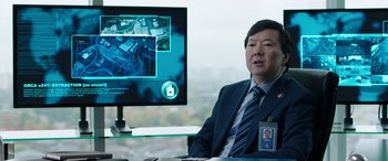 Movie still from “My Spy” (2020), directed by Peter Segal – A man sitting in front of a computer monitor; Close Up shot, Over the shoulder angle