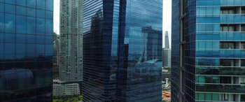 Movie still from “My Spy” (2020), directed by Peter Segal – A view of a building from a window of a building; Extreme Wide shot, Low angle
