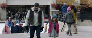 Movie still from “My Spy” (2020), directed by Peter Segal – A man and a little girl walking on the sidewalk; Medium shot, Over the shoulder angle
