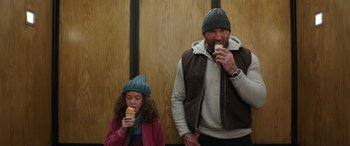 Movie still from “My Spy” (2020), directed by Peter Segal – A man and a little girl are eating some food; Medium shot, Over the shoulder angle