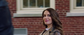 Movie still from “My Spy” (2020), directed by Peter Segal – A beautiful woman standing in front of a brick building; Close Up shot, Low angle