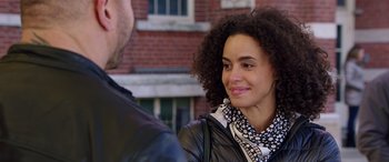 Movie still from “My Spy” (2020), directed by Peter Segal – A woman in a black jacket is talking to a man; Close Up shot, Over the shoulder angle