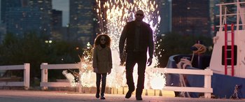Movie still from “My Spy” (2020), directed by Peter Segal – A man and a little girl walking in front of fireworks; Wide shot, Low angle