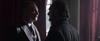 Movie still from “My Spy” (2020), directed by Peter Segal – Two men in a room facing each other in front of a window; Close Up shot, Over the shoulder angle