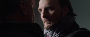 Movie still from “My Spy” (2020), directed by Peter Segal – A person with a beard looking at the camera; Close Up shot, Over the shoulder angle