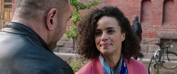 Movie still from “My Spy” (2020), directed by Peter Segal – A man and a woman standing next to each other; Close Up shot, Over the shoulder angle