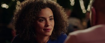 Movie still from “My Spy” (2020), directed by Peter Segal – A person with curly brown hair; Close Up shot, Over the shoulder angle