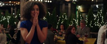 Movie still from “My Spy” (2020), directed by Peter Segal – A woman standing in front of a group of diners; Close Up shot, Over the shoulder angle