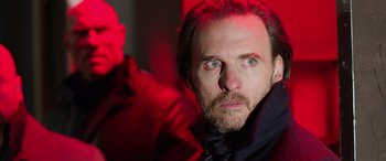 Movie still from “My Spy” (2020), directed by Peter Segal – A person with a beard; Close Up shot, Over the shoulder angle