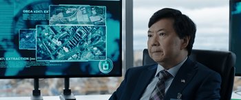 Movie still from “My Spy” (2020), directed by Peter Segal – A man sitting in front of a computer screen; Close Up shot, Over the shoulder angle