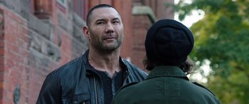 Movie still from “My Spy” (2020), directed by Peter Segal – A man in a leather jacket talking to another man in a black jacket; Close Up shot, Over the shoulder angle