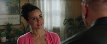 Movie still from “My Spy” (2020), directed by Peter Segal – A woman in a pink shirt is looking at the camera; Close Up shot, Over the shoulder angle