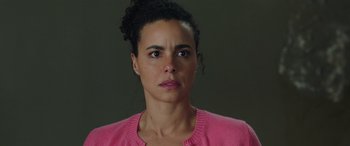Movie still from “My Spy” (2020), directed by Peter Segal – A person wearing a pink sweater; Close Up shot, Over the shoulder angle