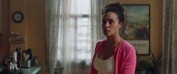 Movie still from “My Spy” (2020), directed by Peter Segal – A woman standing in a room with a window in the background; Close Up shot, Low angle