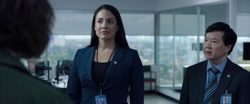 Movie still from “My Spy” (2020), directed by Peter Segal – A woman in a blue suit stands in an empty room; Close Up shot, Over the shoulder angle