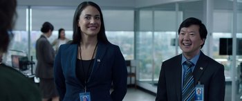 Movie still from “My Spy” (2020), directed by Peter Segal – A woman standing next to a man in a room; Medium shot, Over the shoulder angle