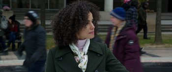 Movie still from “My Spy” (2020), directed by Peter Segal – A person with curly hair wearing a coat; Close Up shot, Over the shoulder angle