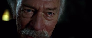 Movie still from “National Treasure” (2004), directed by Jon Turteltaub – An older man with a gray beard looking at the camera; Extreme Close Up shot, Low angle