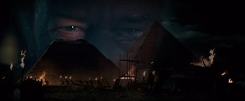 Movie still from “National Treasure” (2004), directed by Jon Turteltaub – A group of people standing in front of a pyramid at night; Extreme Close Up shot, Low angle