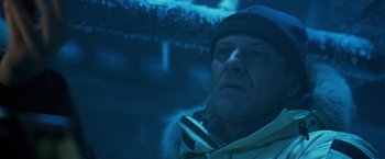 Movie still from “National Treasure” (2004), directed by Jon Turteltaub – A person wearing a jacket and hat; Close Up shot, Low angle