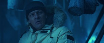 Movie still from “National Treasure” (2004), directed by Jon Turteltaub – A person wearing a jacket and hat; Close Up shot, Over the shoulder angle