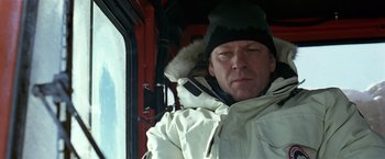 Movie still from “National Treasure” (2004), directed by Jon Turteltaub – A man wearing a white parka and a black hat; Close Up shot, Low angle