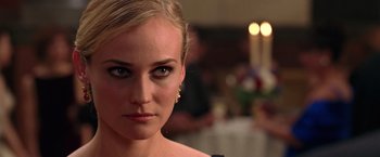 Movie still from “National Treasure” (2004), directed by Jon Turteltaub – A woman's face in front of candles; Close Up shot, Over the shoulder angle