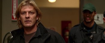 Movie still from “National Treasure” (2004), directed by Jon Turteltaub – A person wearing a black jacket; Close Up shot, Low angle