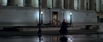 Movie still from “National Treasure” (2004), directed by Jon Turteltaub – A woman is walking down the street at night; Extreme Wide shot, Low angle