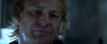 Movie still from “National Treasure” (2004), directed by Jon Turteltaub – A person with blonde hair; Close Up shot, Low angle