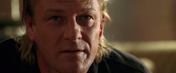 Movie still from “National Treasure” (2004), directed by Jon Turteltaub – A man with blonde hair and blue eyes; Close Up shot, Low angle