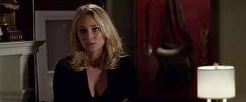 Movie still from “National Treasure” (2004), directed by Jon Turteltaub – A woman with long blonde hair wearing a black top; Close Up shot, Over the shoulder angle